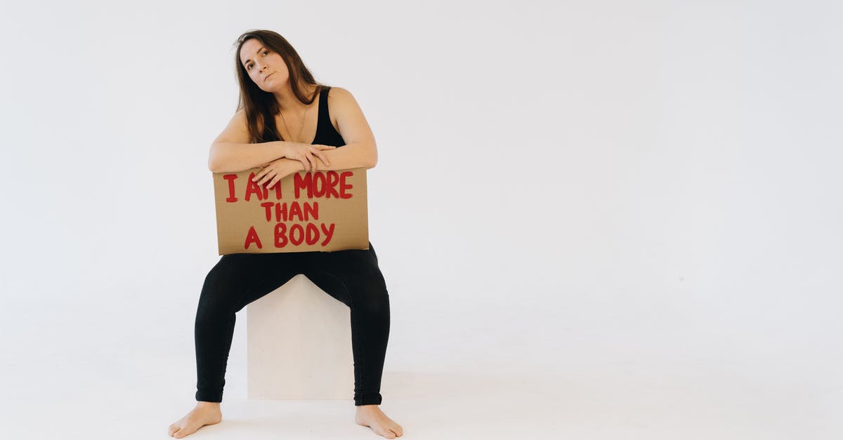 Am I poisoned forever? - A Woman Showing a Placard