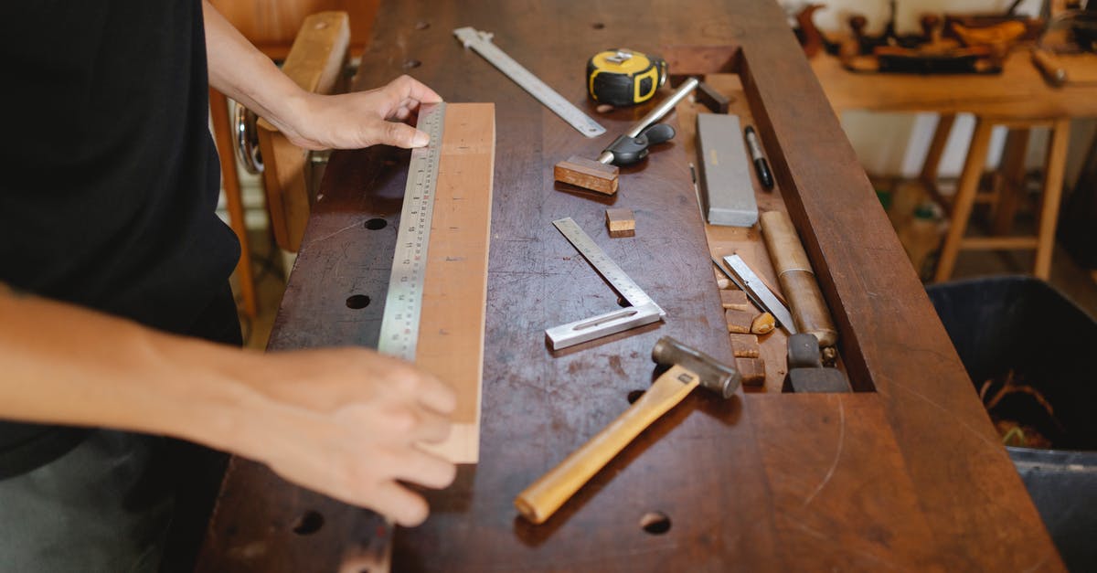 Are all PAL-versions limited by the "PAL-bug" and were any measures taken to fix it? - Man working with wood and ruler in carpentry studio Are all PAL-versions limited by the "PAL-bug" and were any measures taken to fix it? - Man working with wood and ruler in carpentry studio