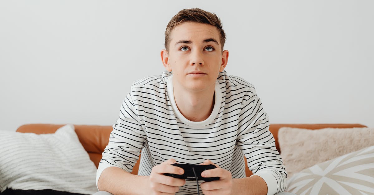 Are any game modes locked behind DLC? - Teenage Boy Sitting on a Couch and Playing Video Games 