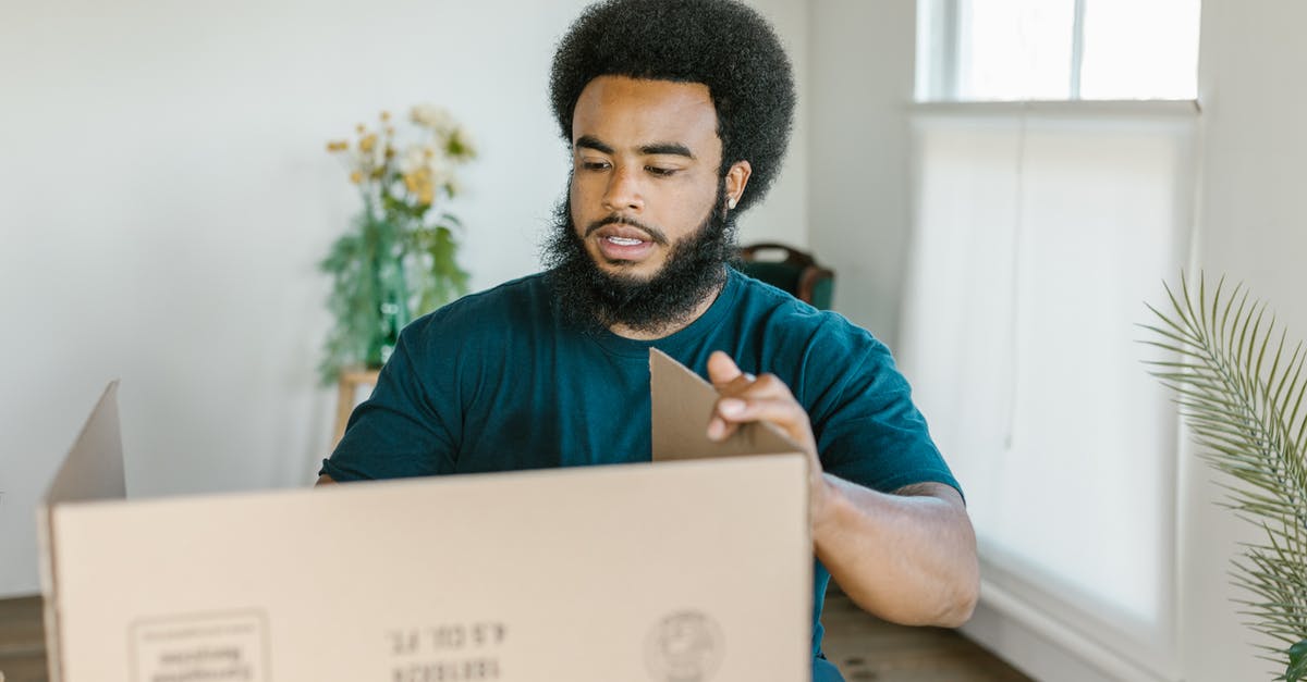 Are Holo-Packs predetermined? - A Man Holding a Cardboard Box