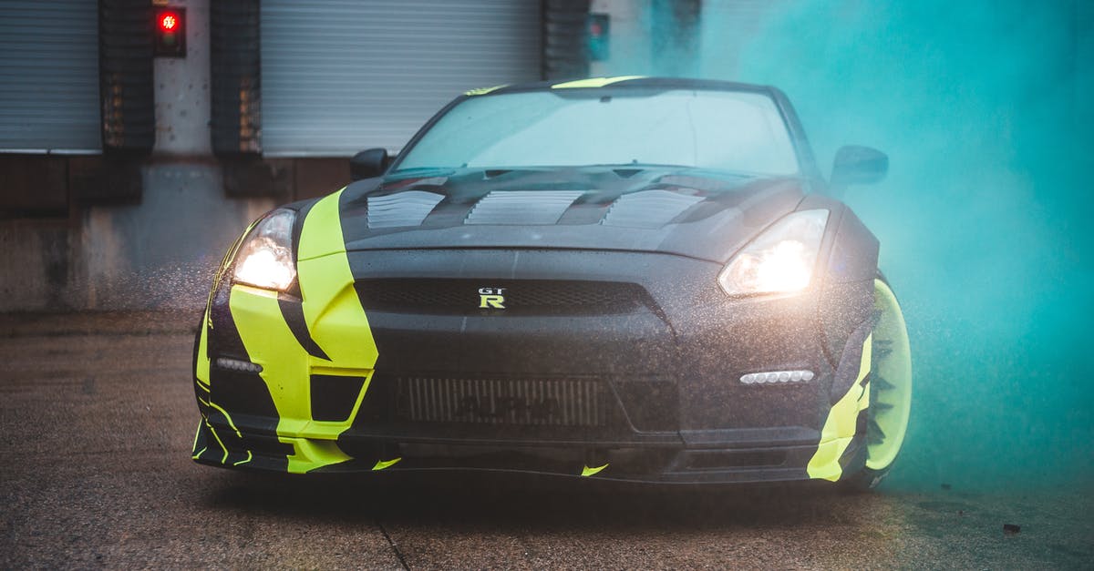 Are Smoke Grenades cumulative? - Contemporary sports car with headlights lights and yellow wrapping design parked near wall with closed blinds in green fume from smoke bomb