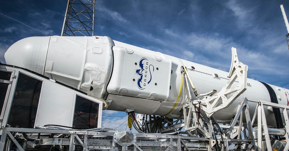 Are strategic resources secretively revealed before the required technology? - Low angle of solid rocket booster placed on industrial machine platform for transportation and installation against blue sky