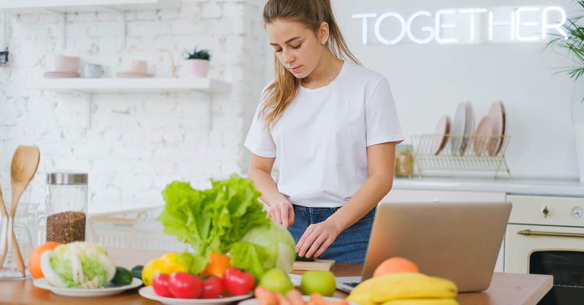 Are there any benefits to food that isn't favoured by anything? - Woman Standing at Table with Vegetables