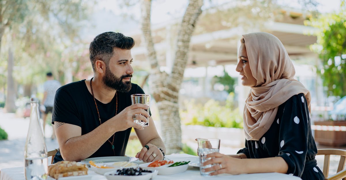 Are there any benefits to food that isn't favoured by anything? - Couple Sitting at Table Having Dinner