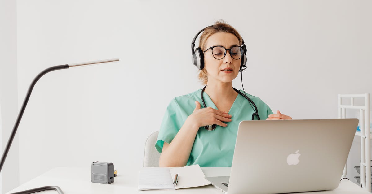 Are there downsides to using V.A.T.S? - Woman in Teal Polo Shirt Wearing Black Framed Eyeglasses Using Macbook