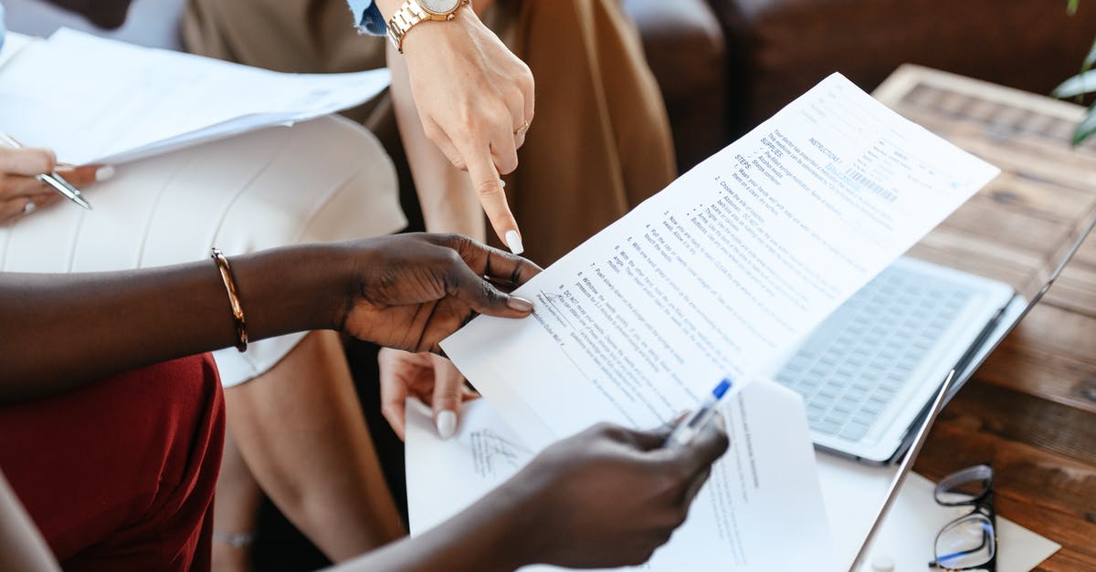 Are trading skills important for caravans - Multiethnic businesswomen checking information in documents