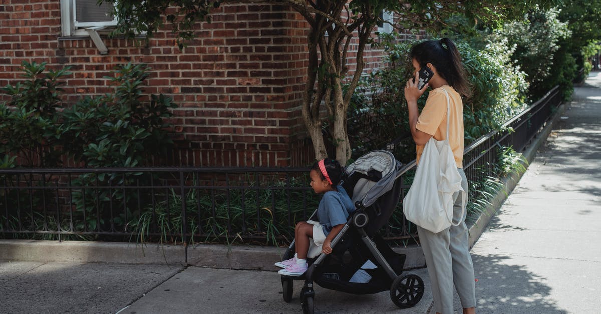 Best way to dynamically call function - Asian woman on street with daughter in baby stroller