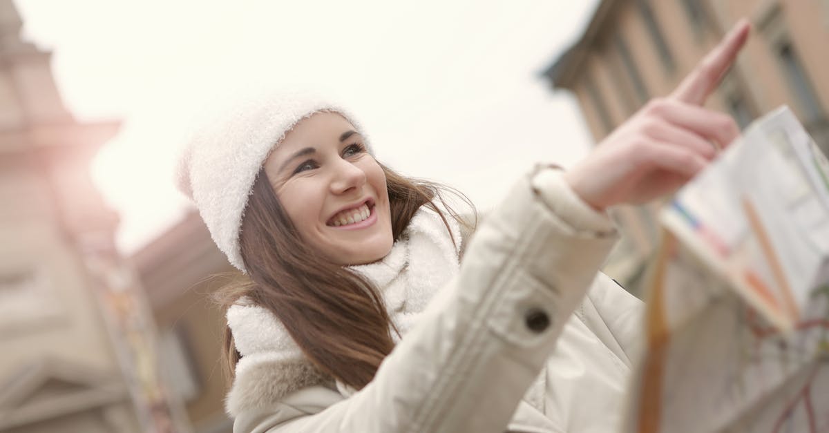 Best way to find treasure maps - Happy lady finding right direction