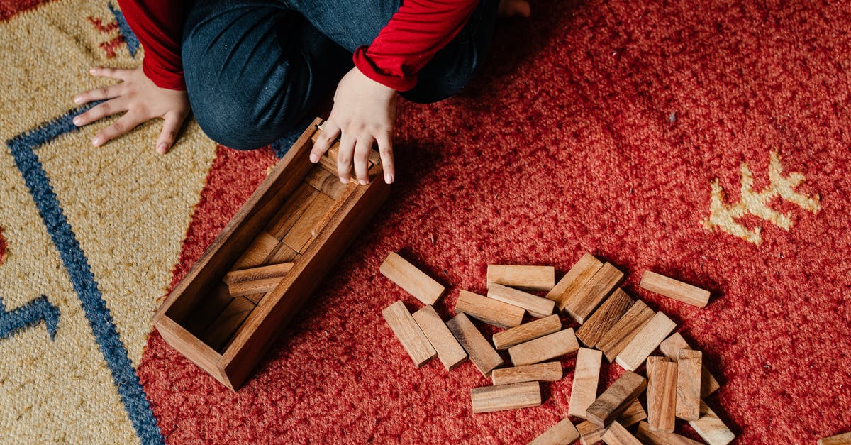 Block rotation preview box - Unrecognizable child playing jenga at home