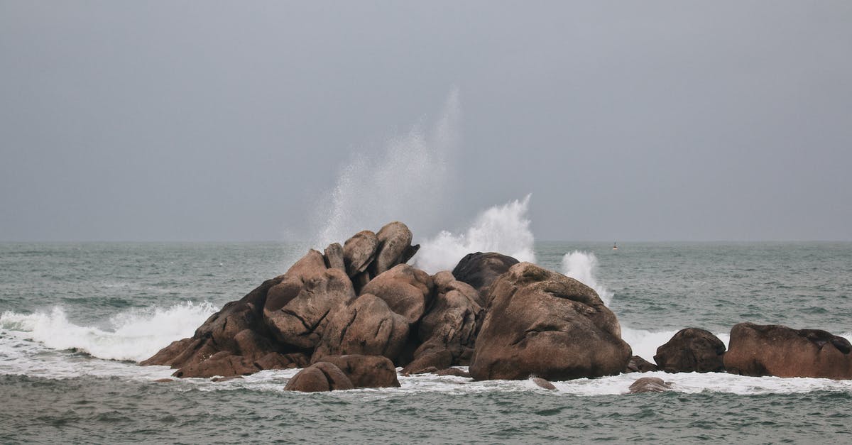 Blocks reappearing after breaking - Brown Rock Formation on Sea