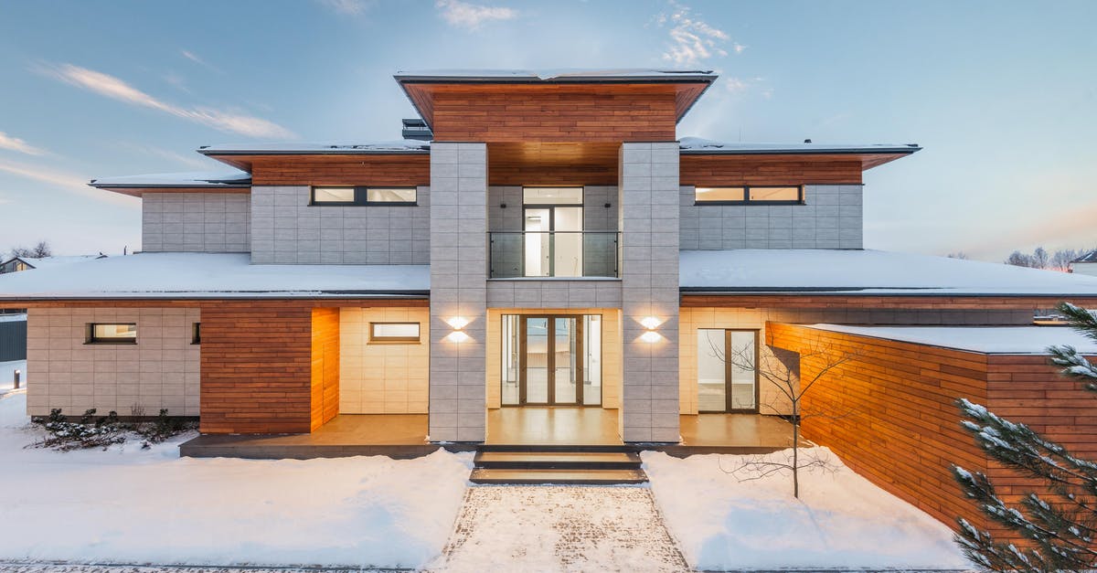 Borderlands 2 - nobody dies! [closed] - Backyard view of new modern luxurious cottage house with stone and wooden facade and illumination in winter countryside