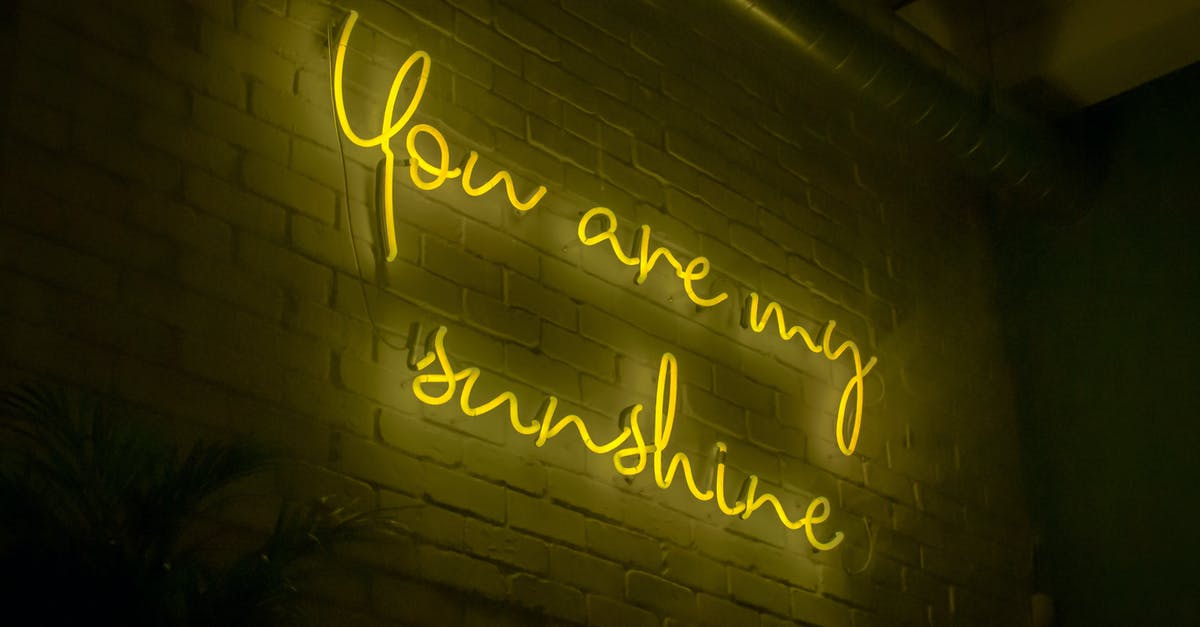 Brick Rigs Graphics Issue - From below of illuminated signboard You are my sunshine with yellow neon light on white wall in dark room