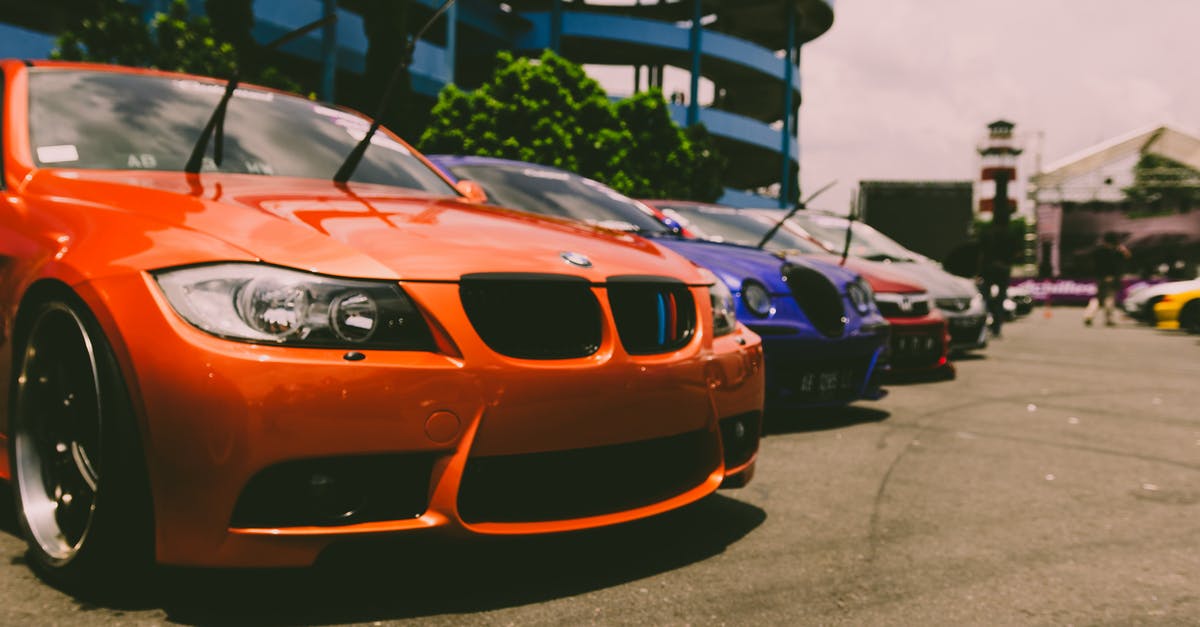 Building cost when fast building - Cars Parked Outside on Concrete Road