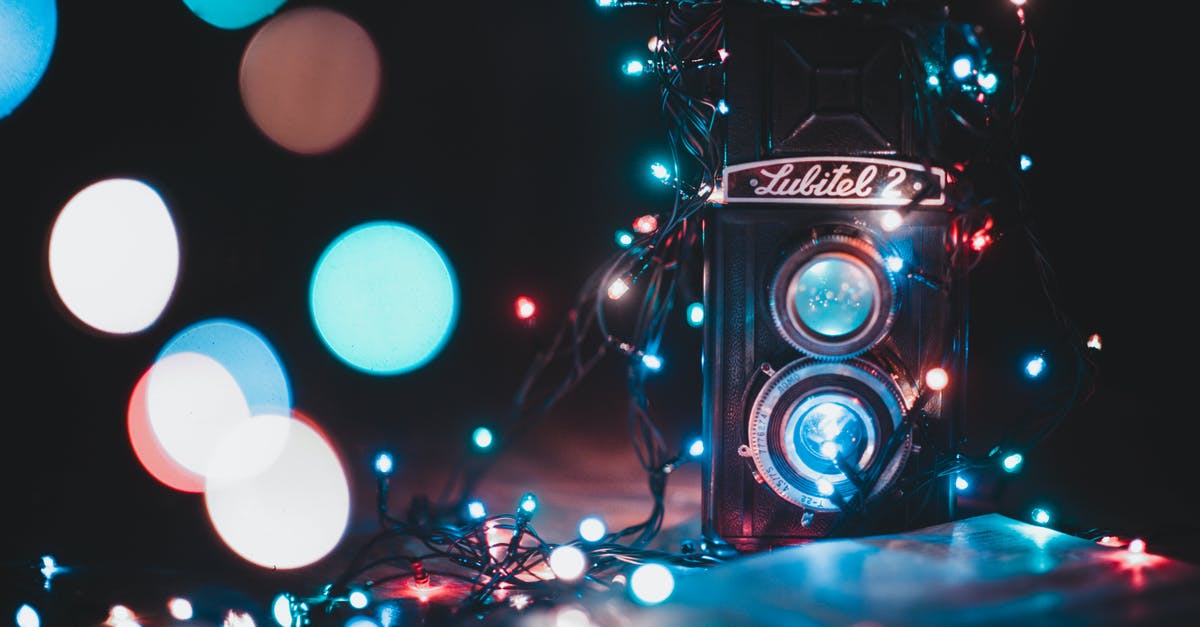 Camera unresponsive in Witcher 2; how can I get it unstuck? - Black and Grey Lubitel 2 Camera Covered With String Lights