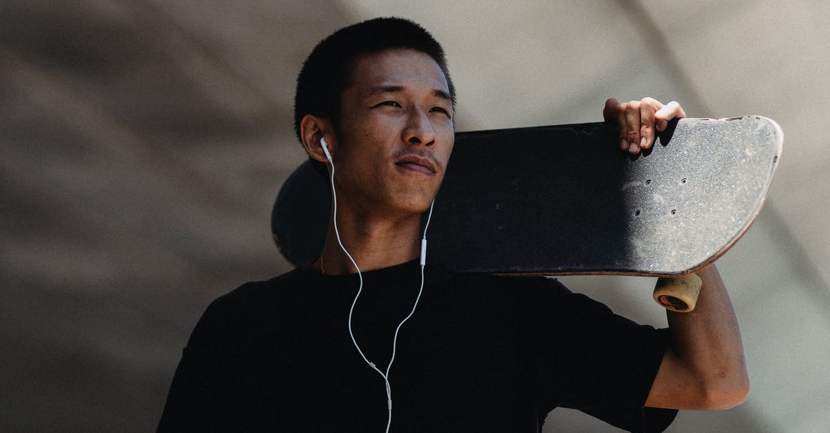 Can't hear any sound on True Skate - Young Asian man with earphones and skateboard