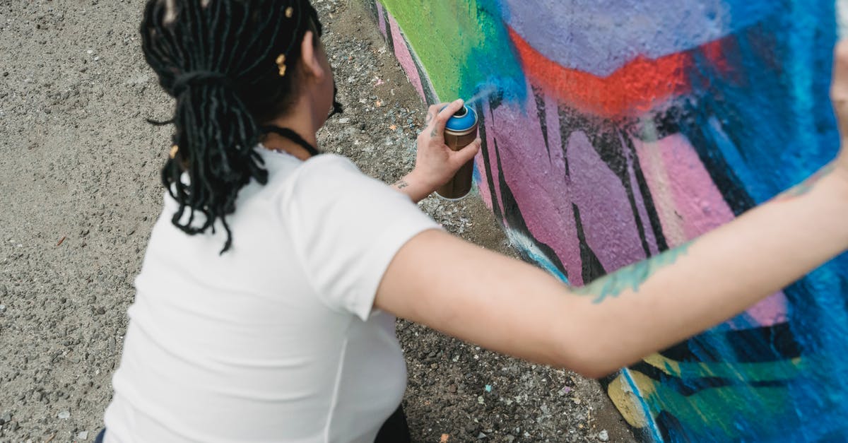 Can Cypher trapwires be destroyed from either side? - Faceless woman spraying paint from can