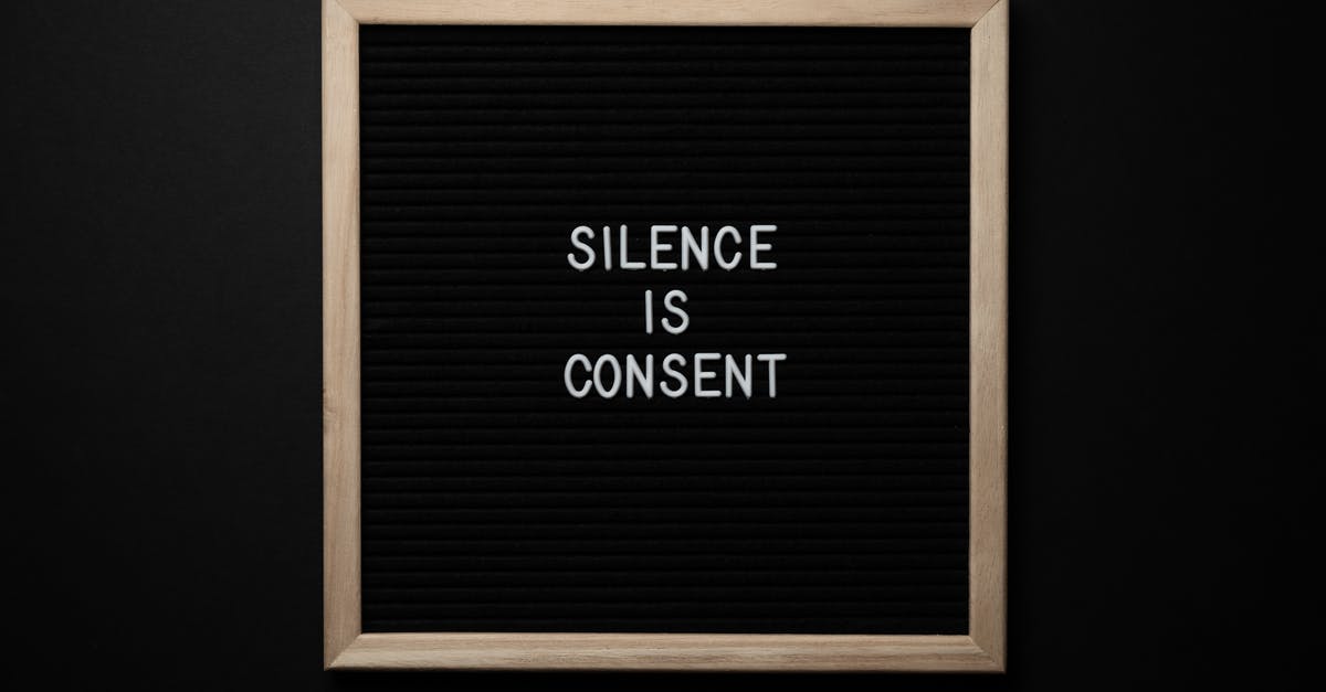 Can I change my character's voice after starting the game? - From above blackboard with written phrase SILENCE IS CONSENT on center on black background