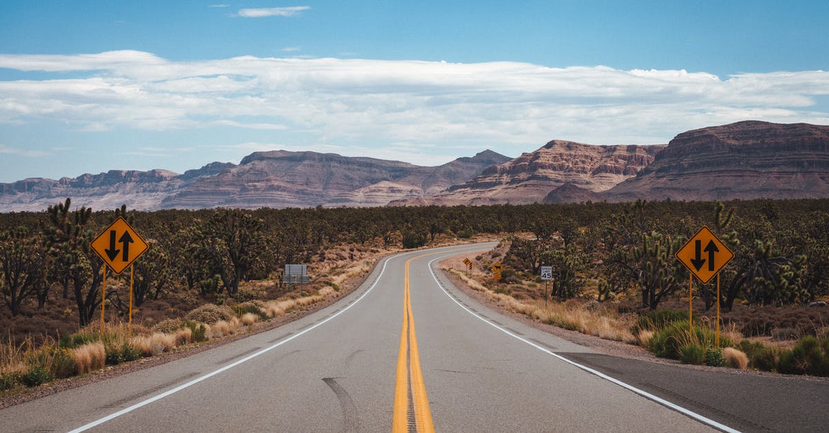 Can I de-rockify rocky terrain in SMAC - Empty asphalt road going through cactus fields towards rocky mountains against cloudy blue sky in United States of America