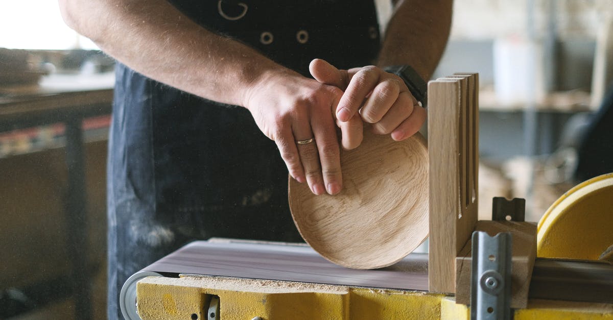 Can I find all the Tetra Master cards in Disc 4? - Unrecognizable male woodworker shaping round wooden detail while working at belt and disc sander in professional workshop on blurred background