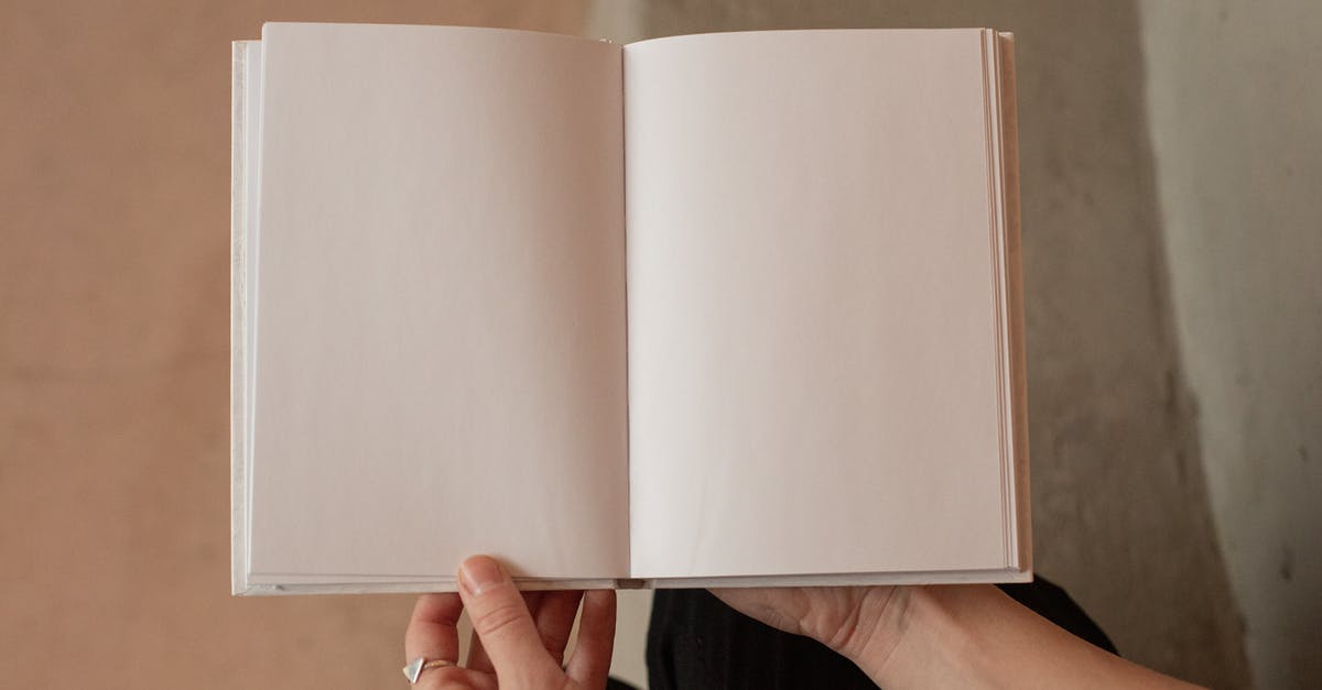 Can I read diary entries I missed? - Woman holding book with blank pages