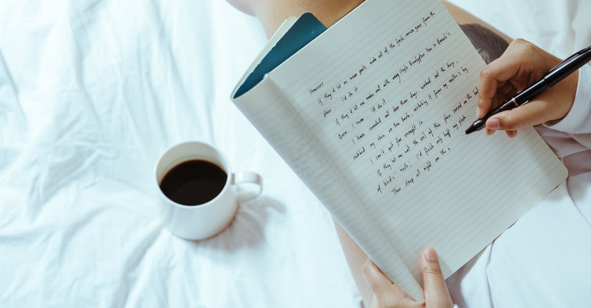 Can I read diary entries I missed? - Top view of unrecognizable woman sitting on bed with legs near cup of coffee and writing on notepad with pen while resting at home