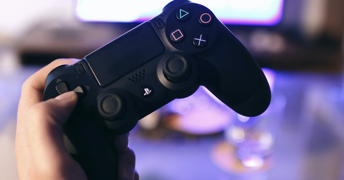 Can I use a PS4 controller on a PS3? - Person Holding Sony Ps4 Dualshock 4