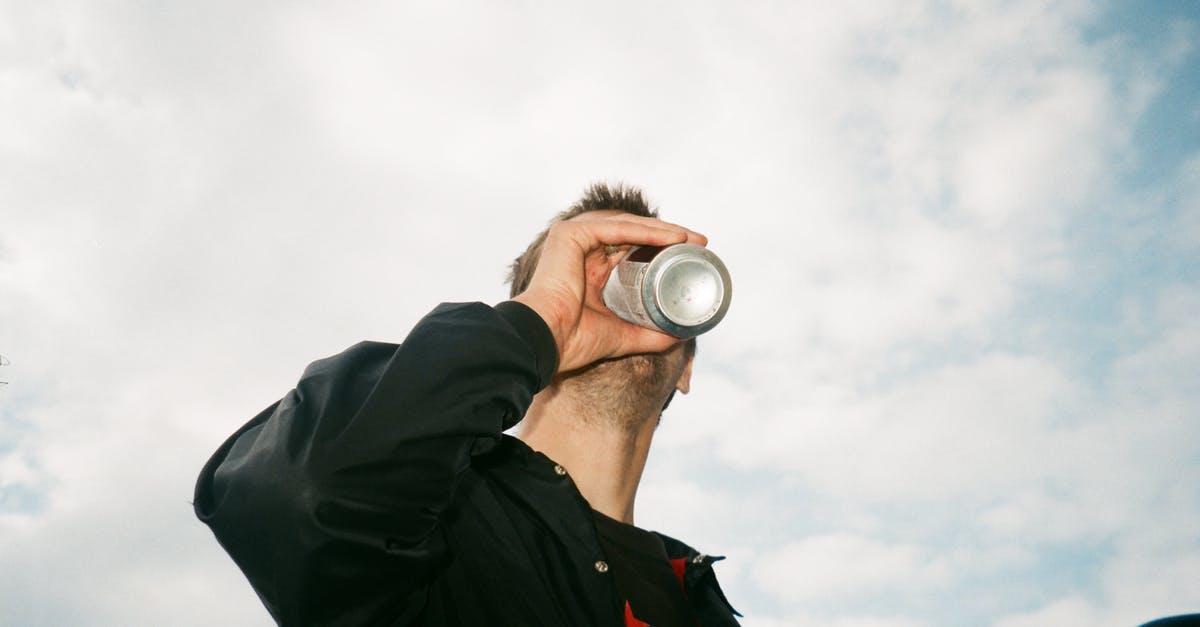 Can Microsoft wipe Xbox cloud saves due to inactivity? - Low Angle Photography of Man Drinking Gray Labeled Can