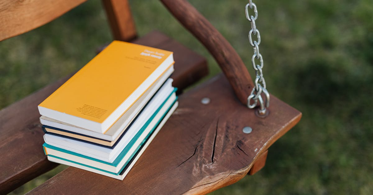 Can "damage over time" effects stack in pokemon? - From above of pile of colorful books on wooden bench of garden swing on quiet summer evening