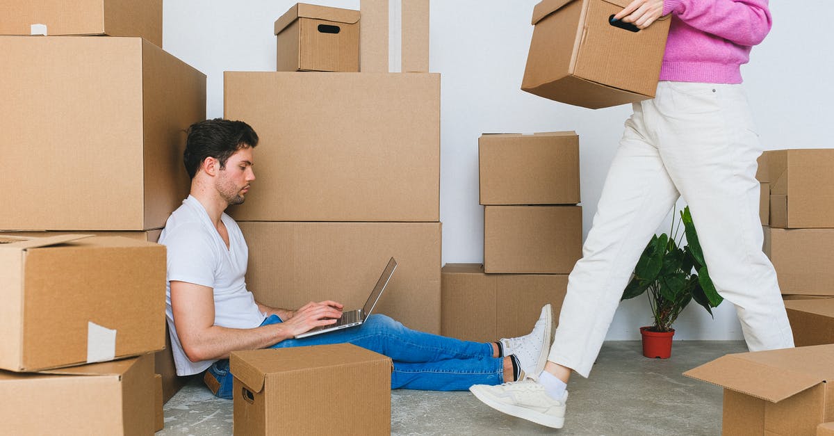 Can the quest "Setup" be completed using the new MP-155 shotgun? - Crop woman arranging carton boxes during relocation with boyfriend using laptop on floor