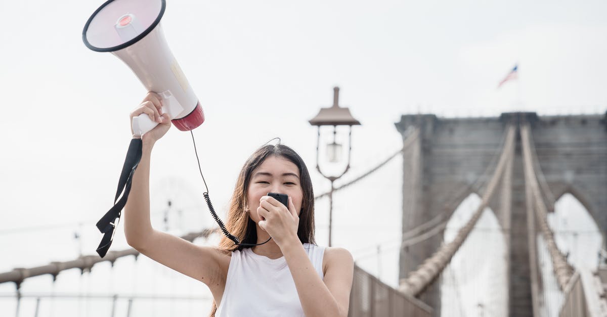 Can you Carve Fortifications into raised bridges? - Woman in White Tank Top Holding White Ceramic Mug