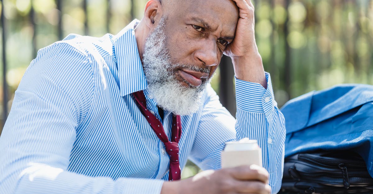 Can you re-recruit Dorn Il-Khan after dismissing him? - Sad black businessman with alcohol drink on street