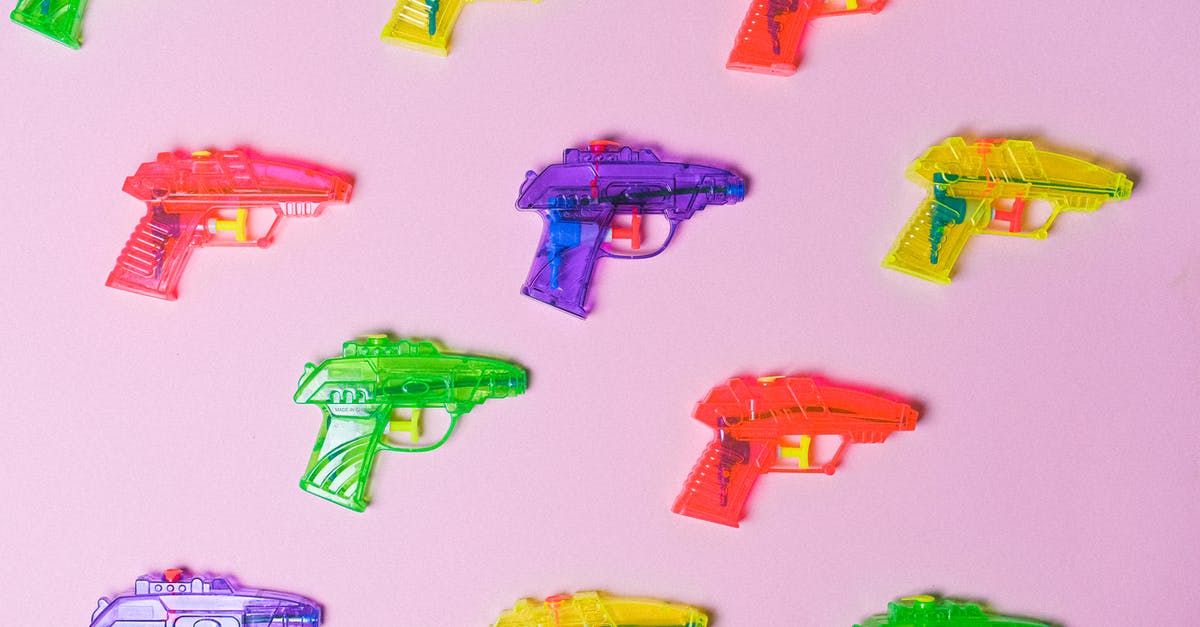 Can you set buy weapon keys in CS:GO? - Top view of various multicolored toys for fight arranged on pink background as representation of game