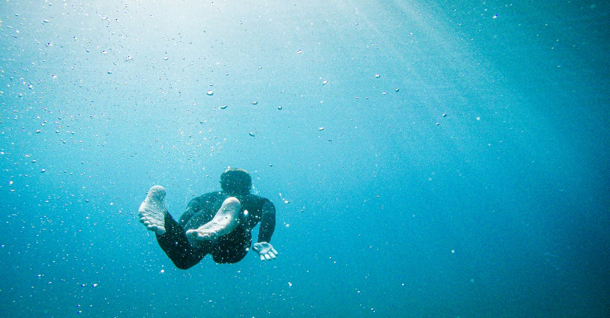 Can you swim underwater? - Diver Swimming in Sea