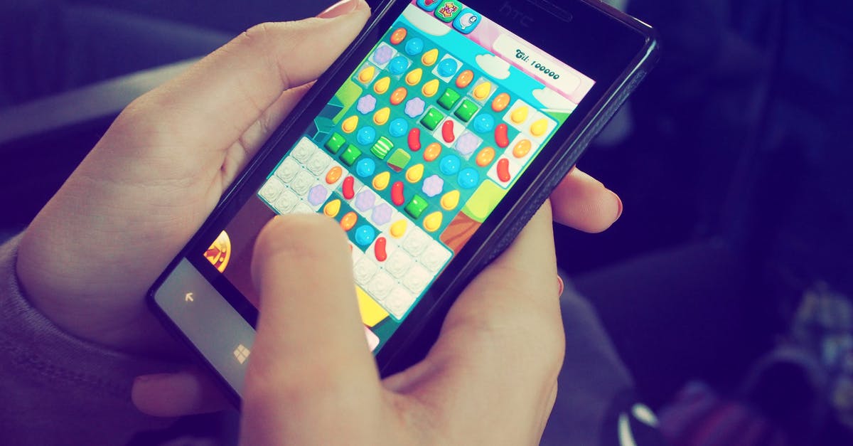 Can you trade in gen 4 games without touchscreen - Person Playing Candy Crush on Nokia Smartphone