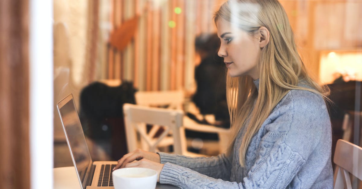 Can you use 2+ hacker arrays on the same resource simultaneously? - Serious young woman using netbook while having hot drink in modern cafe