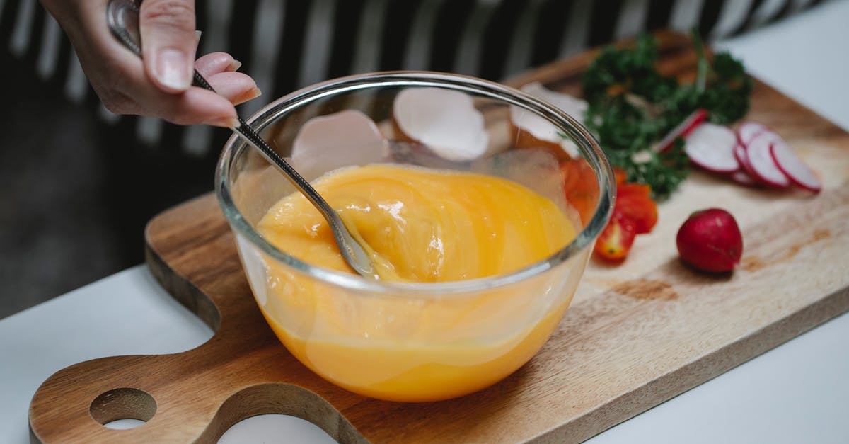 Cannot beat Namir due to dodgy AI in Director's Cut - High angle of crop female beating eggs in glass bowl standing at table with ingredients for breakfast on cutting board