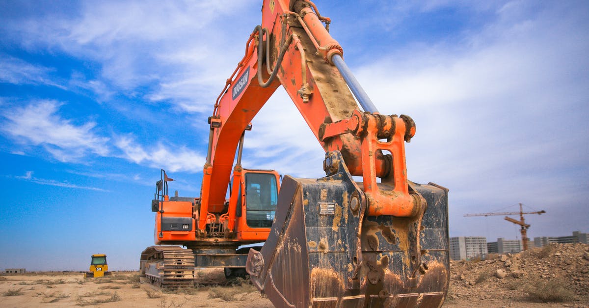 Cannot finish "Intermediate Construction" in Training, because engine is not available - Low Angle Photography of Orange Excavator Under White Clouds