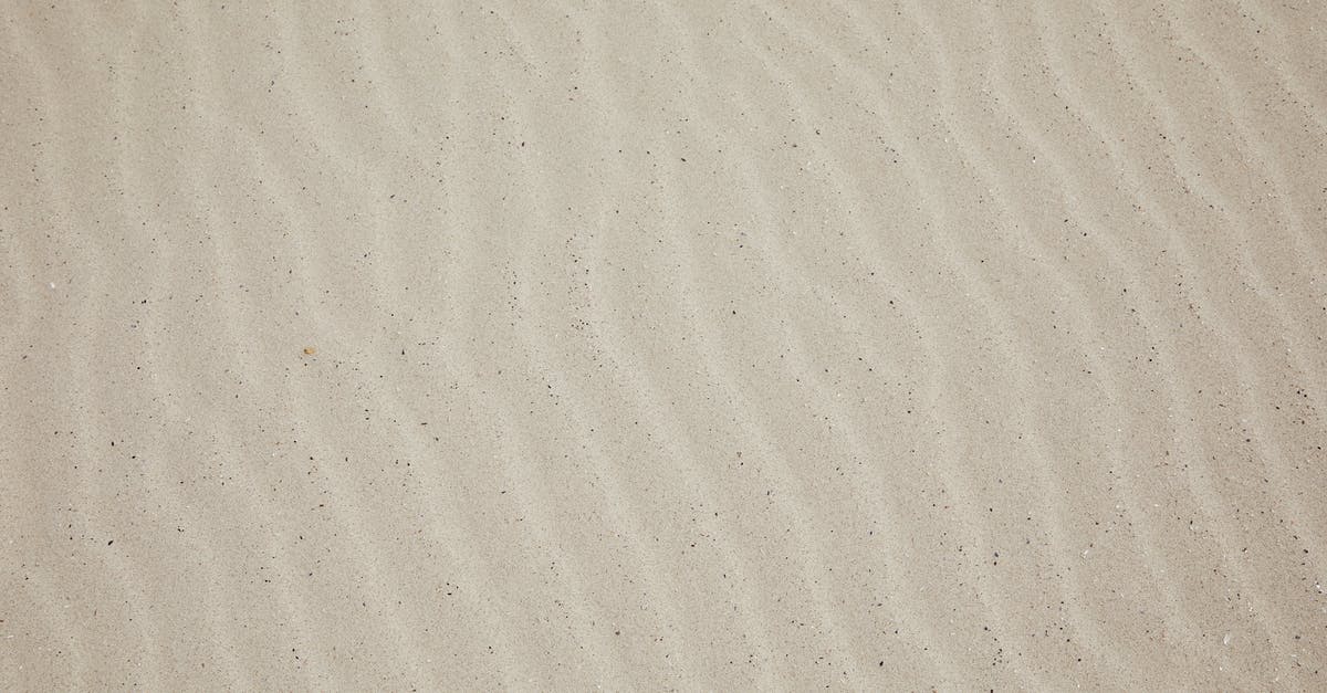 Clearing a location in fallout 4 - Top view of empty dry plain surface of beach covered with sand in daytime