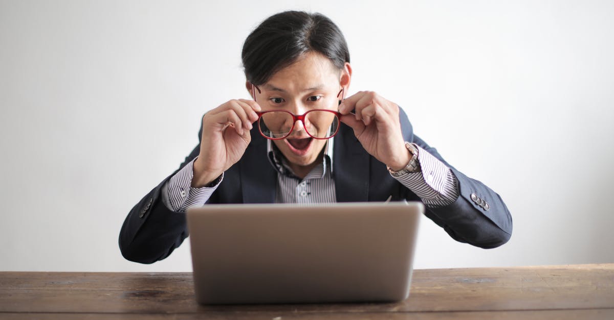 Click-Emerald reaction - Amazed formal male looking at laptop screen