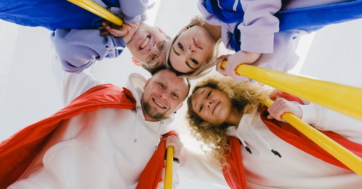 Closed down Steam while downloading a game - Glad sportsmen in group embrace during curling game