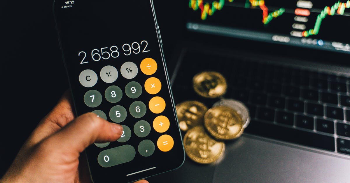 Coins displaying as popsicles? - A Person Holding a Smartphone with a Calculator App on the Screen