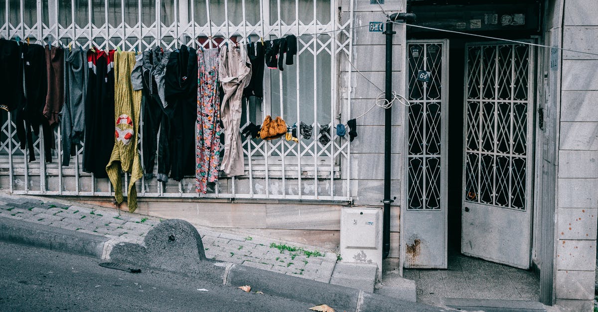 Command Block Door - Laundry drying on clothesline near condominium entrance