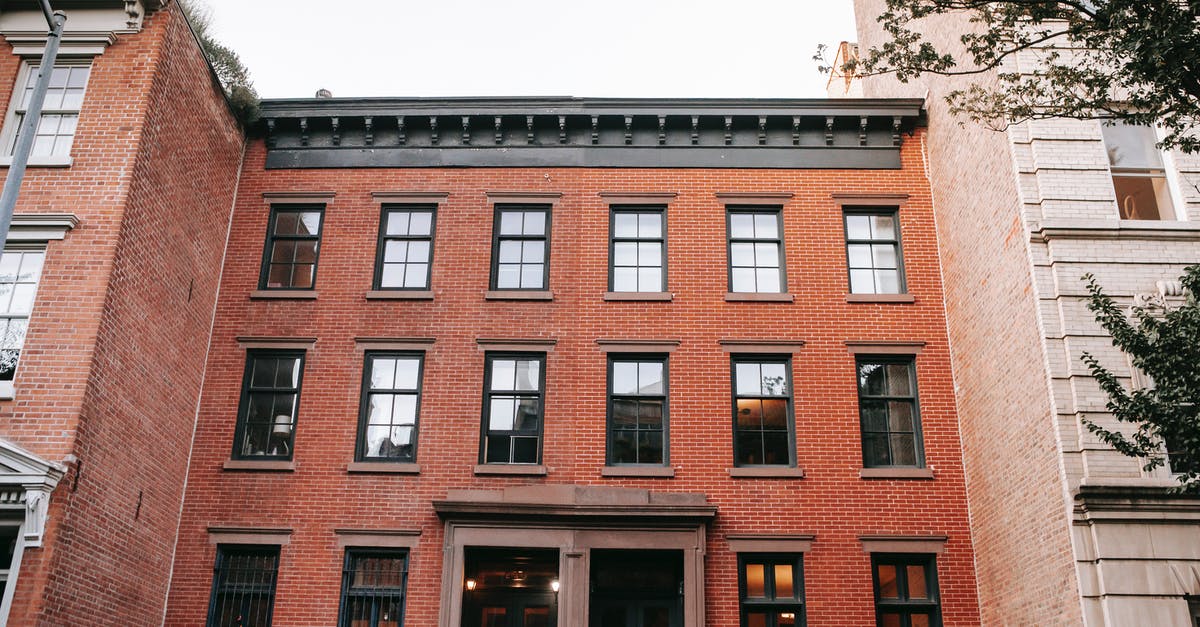 Command Block Door - Facade of brick house with black window frames