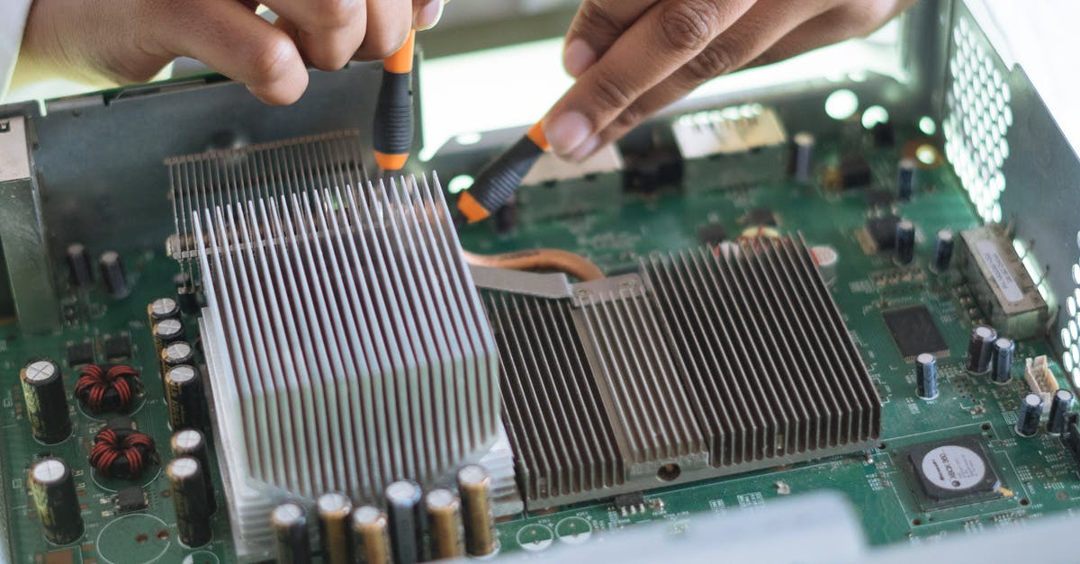 Complimentary Shaders with the M1 chip - Crop technician checking contacts on motherboard in workshop