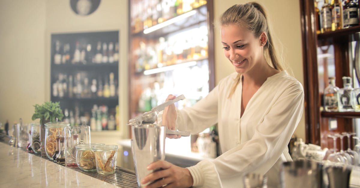 Counter strike 1.6 / condition zero - add Headshot, double kill,... sound - Smiling blonde in white blouse squeezing fresh juice into stainless shaker while preparing cocktail in bar