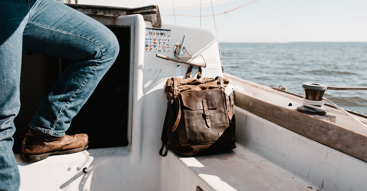 Cursor won't go away since update - Person in Blue Denim Jeans Sitting on Boat