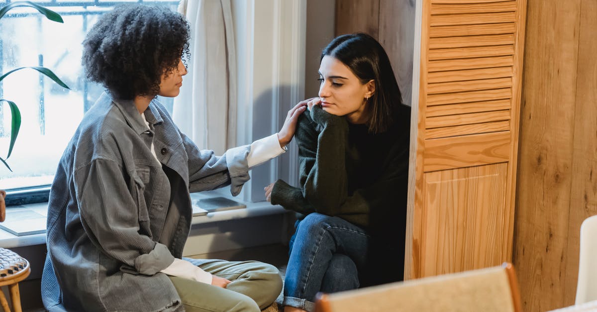 Dialogue help please! - Calm young multiracial female best friends in casual clothes sitting near window and home and discussing discussing problems