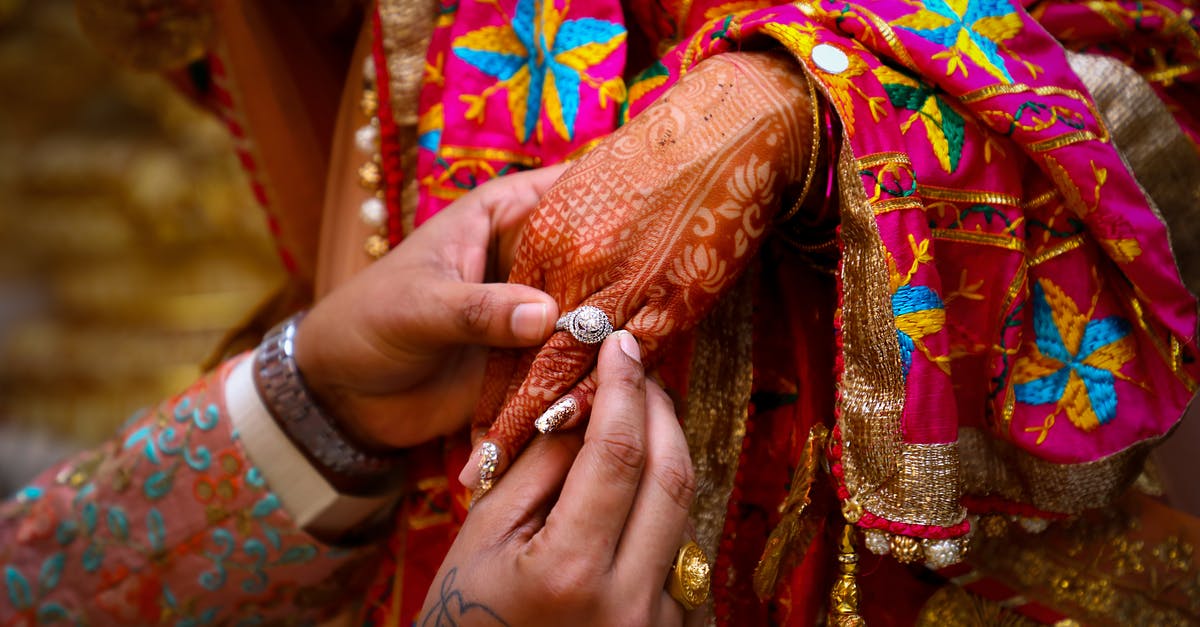 Did Mayor McDonough really expel the ghouls from Diamond City? - Crop Indian man giving ring to woman during traditional wedding ceremony