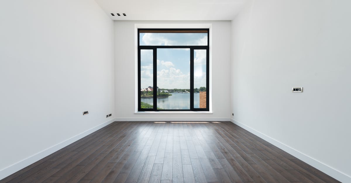 Do all ships have the same amount of space inside them? - Interior of modern spacious light room with wooden laminate floor white walls and panoramic windows