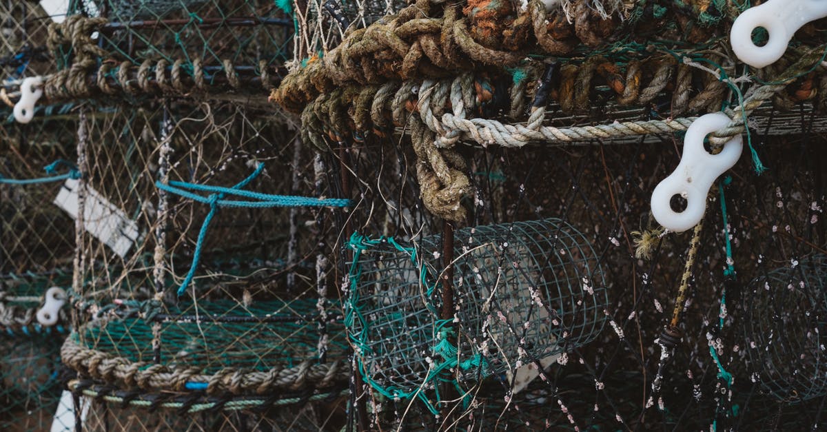 Do different fishing holes have different odds? - Cylindrical fishing nets storage at pier